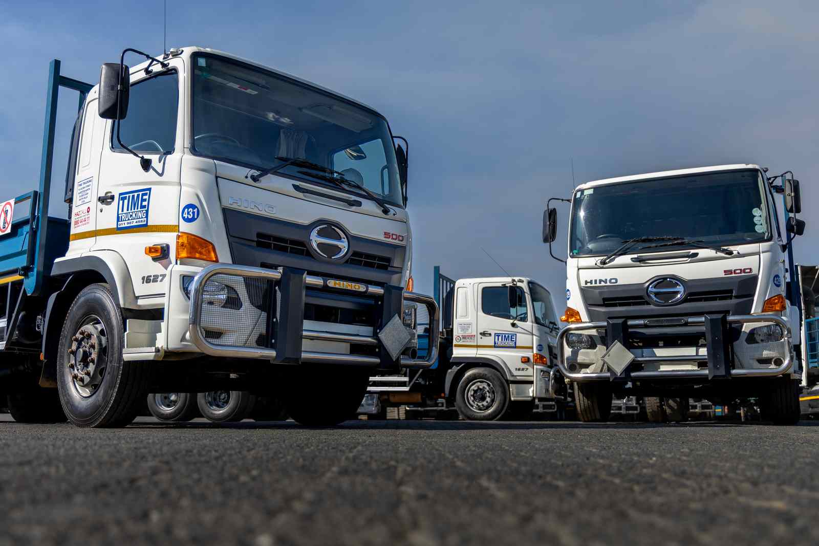 TIME Trucking Hino trucks lined up at the depot